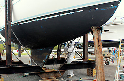 Prepping the boat for bottom painting.